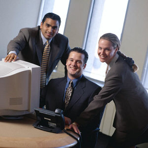 Office workers around a computer.jpg